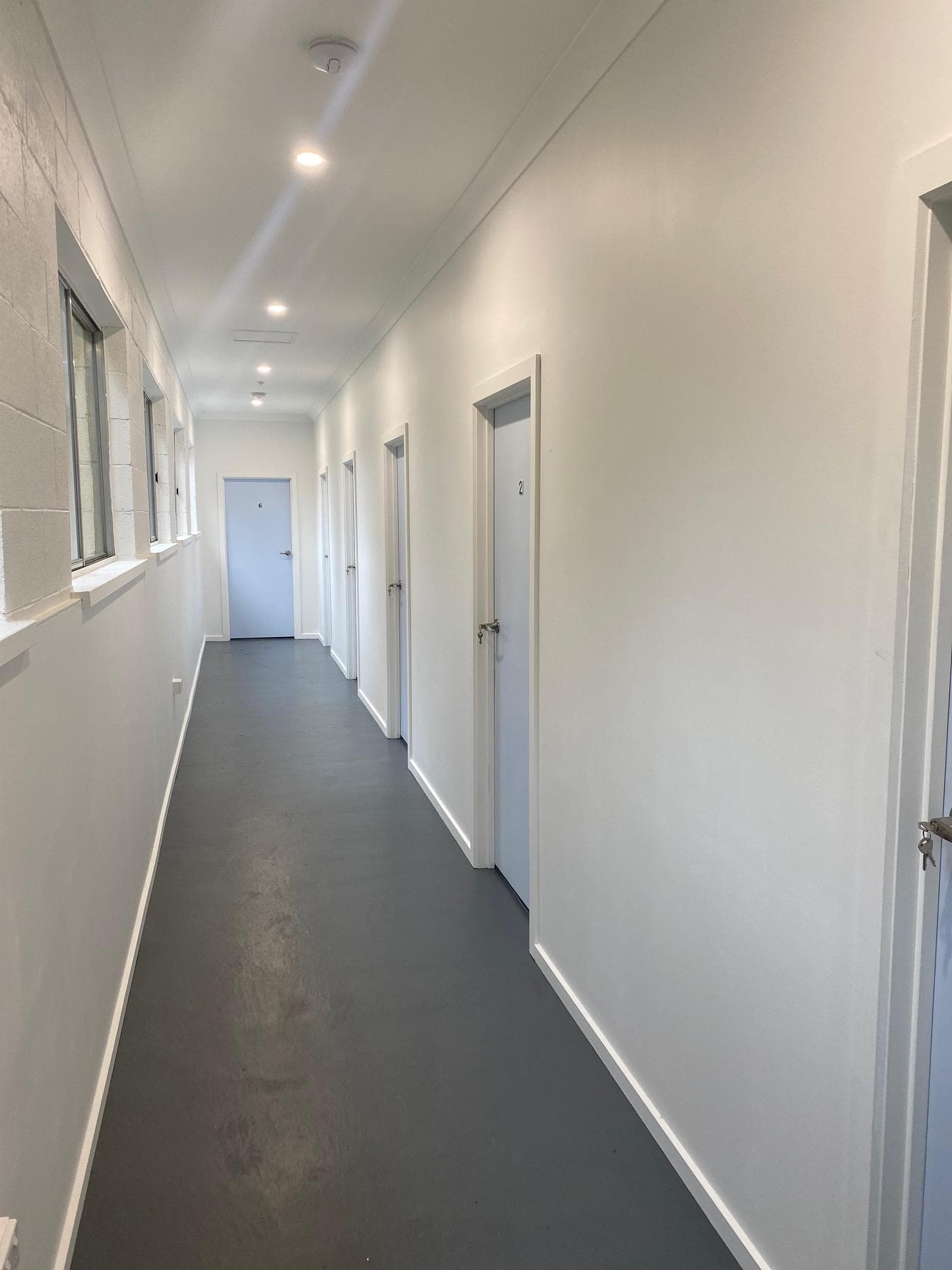 Bright modern corridor with private room doors at Bright Accommodation Park, Great Alpine Road Bright VIC