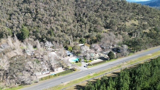Aerial view of Bright Accommodation Park with powered sites nestled in the Victorian Alps along Great Alpine Road